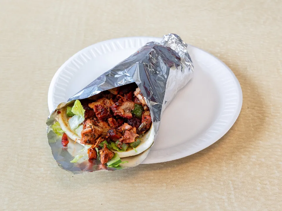 Chicken gyro wrapped in pita and foil