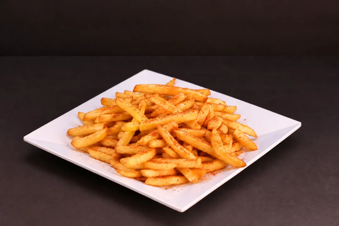 Masala fries on a white plate